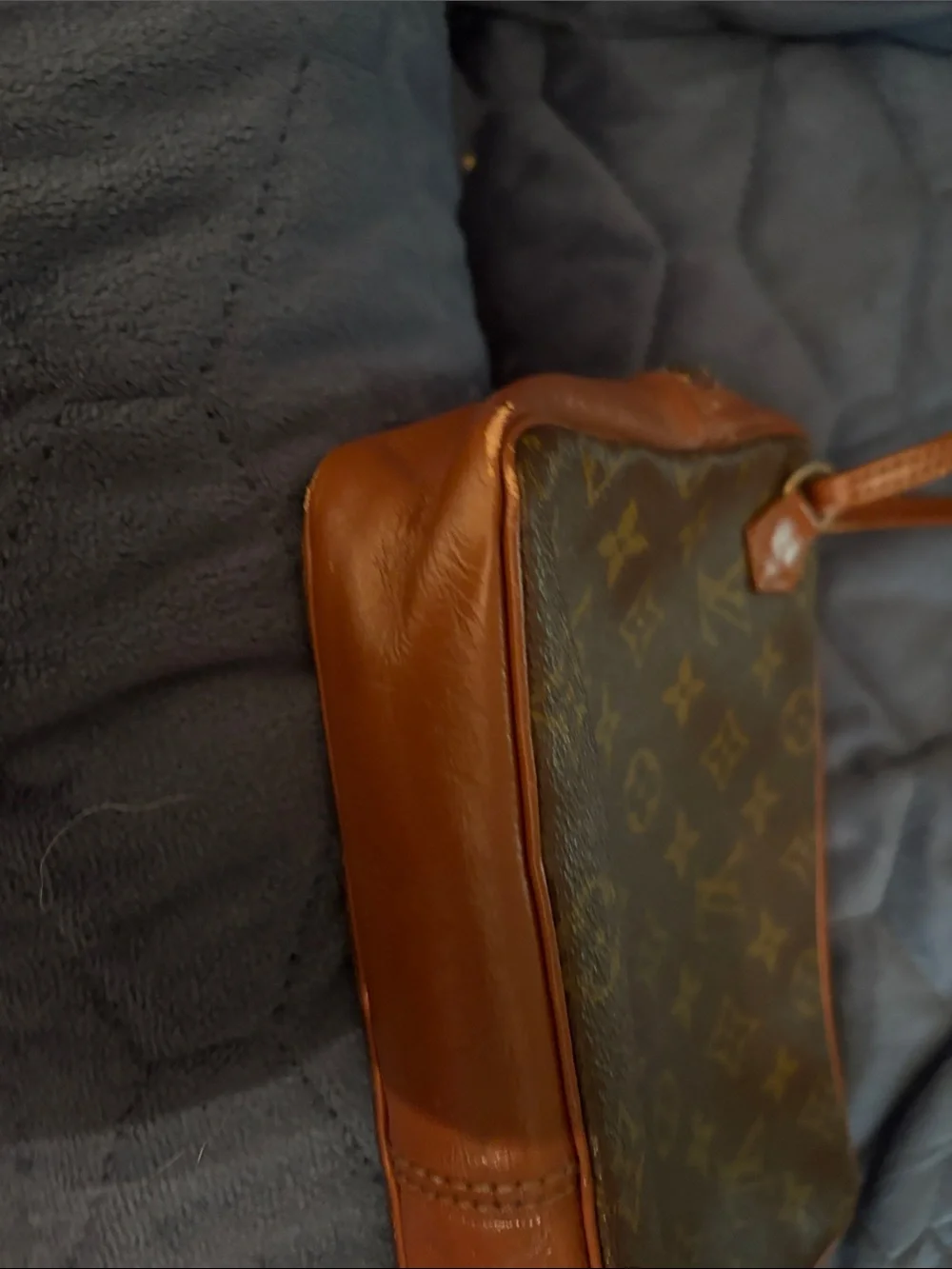 Louis Vuitton Brown Leather Monogram cosmetic case with wristlet strap.